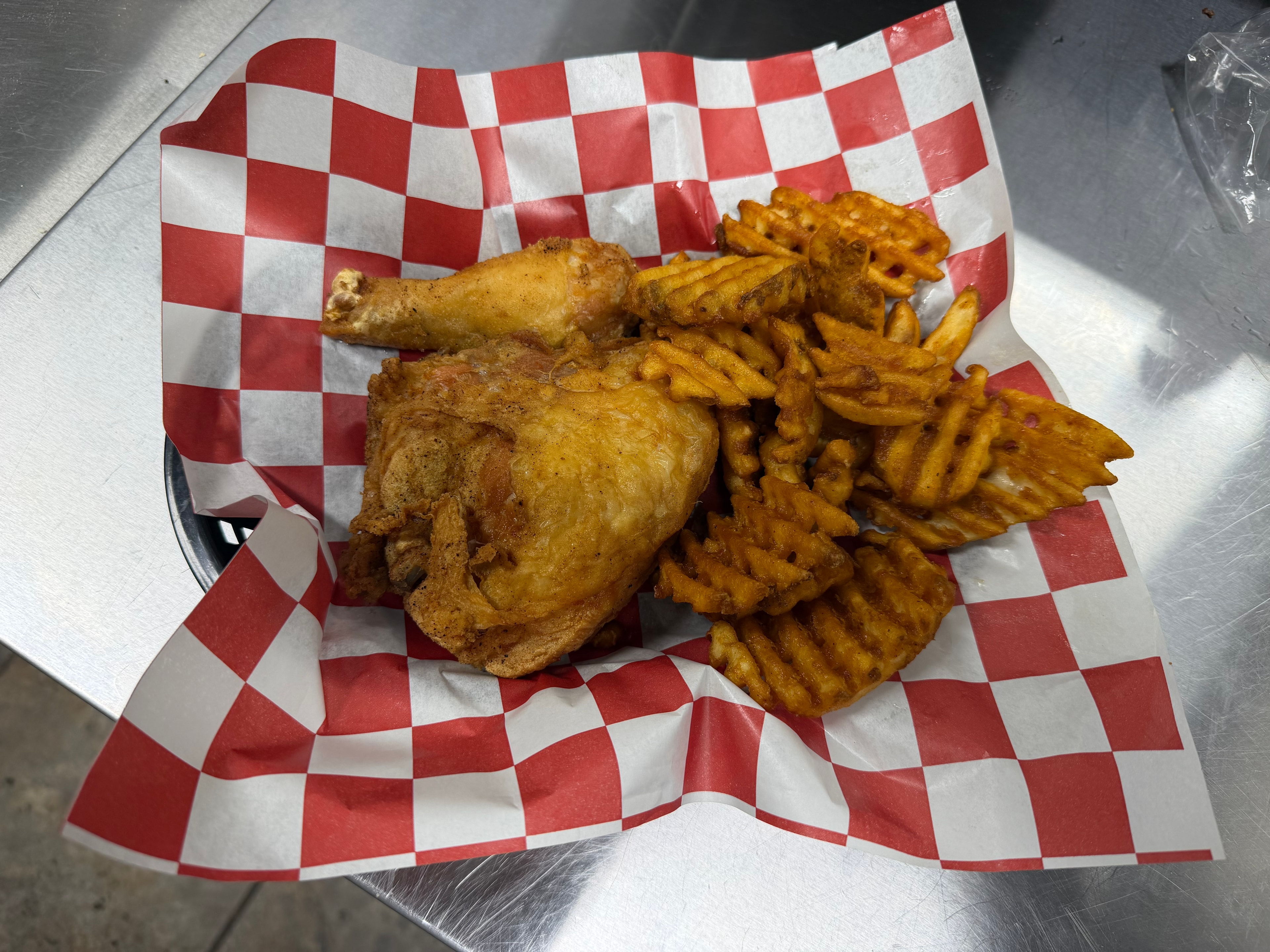 Broasted chicken with waffle fries at Nina's