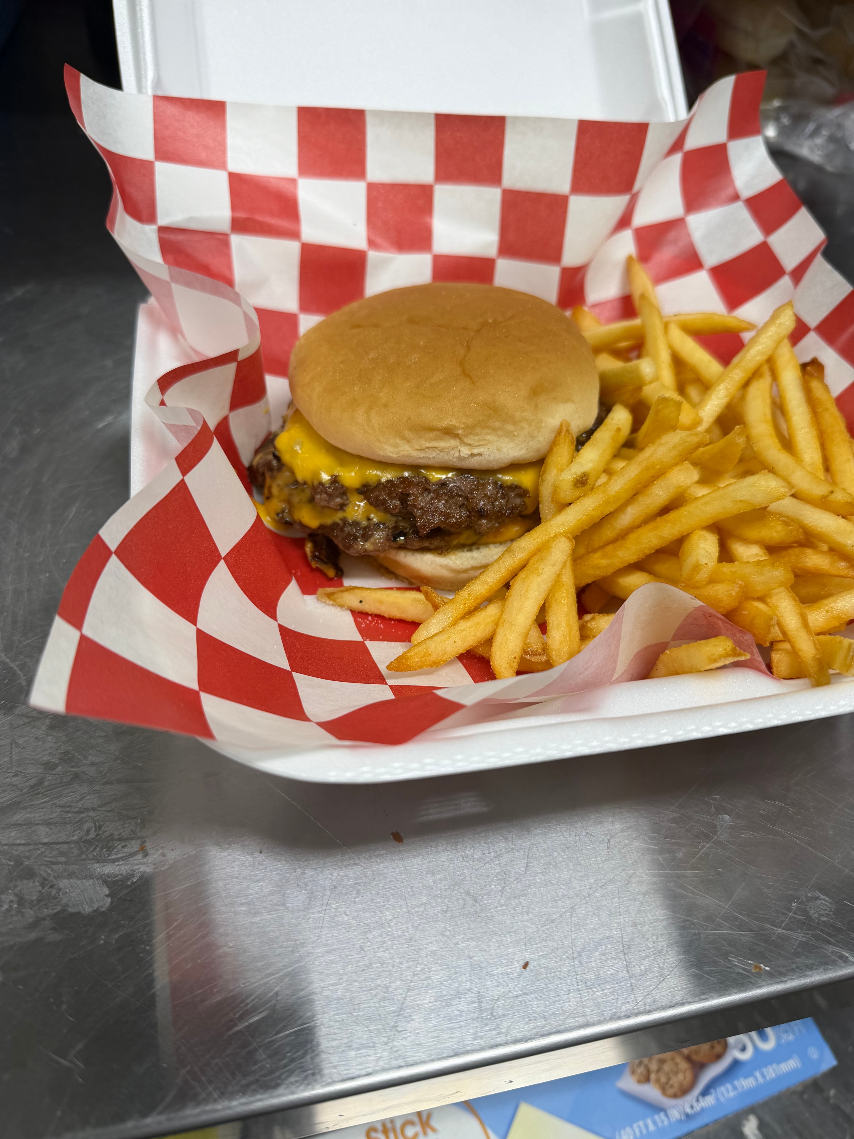 Cheeseburger and fries at Nina's