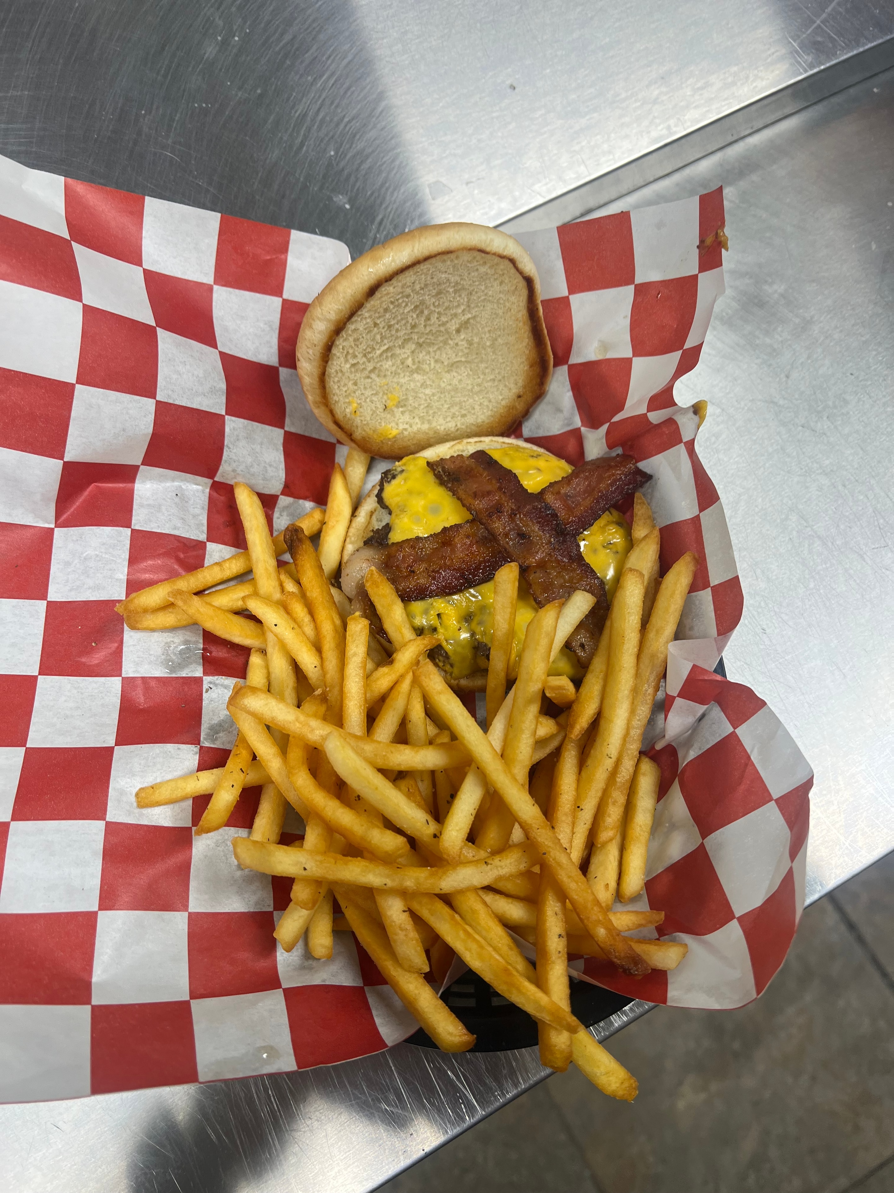 Bacon burger loaded with fries at Nina's