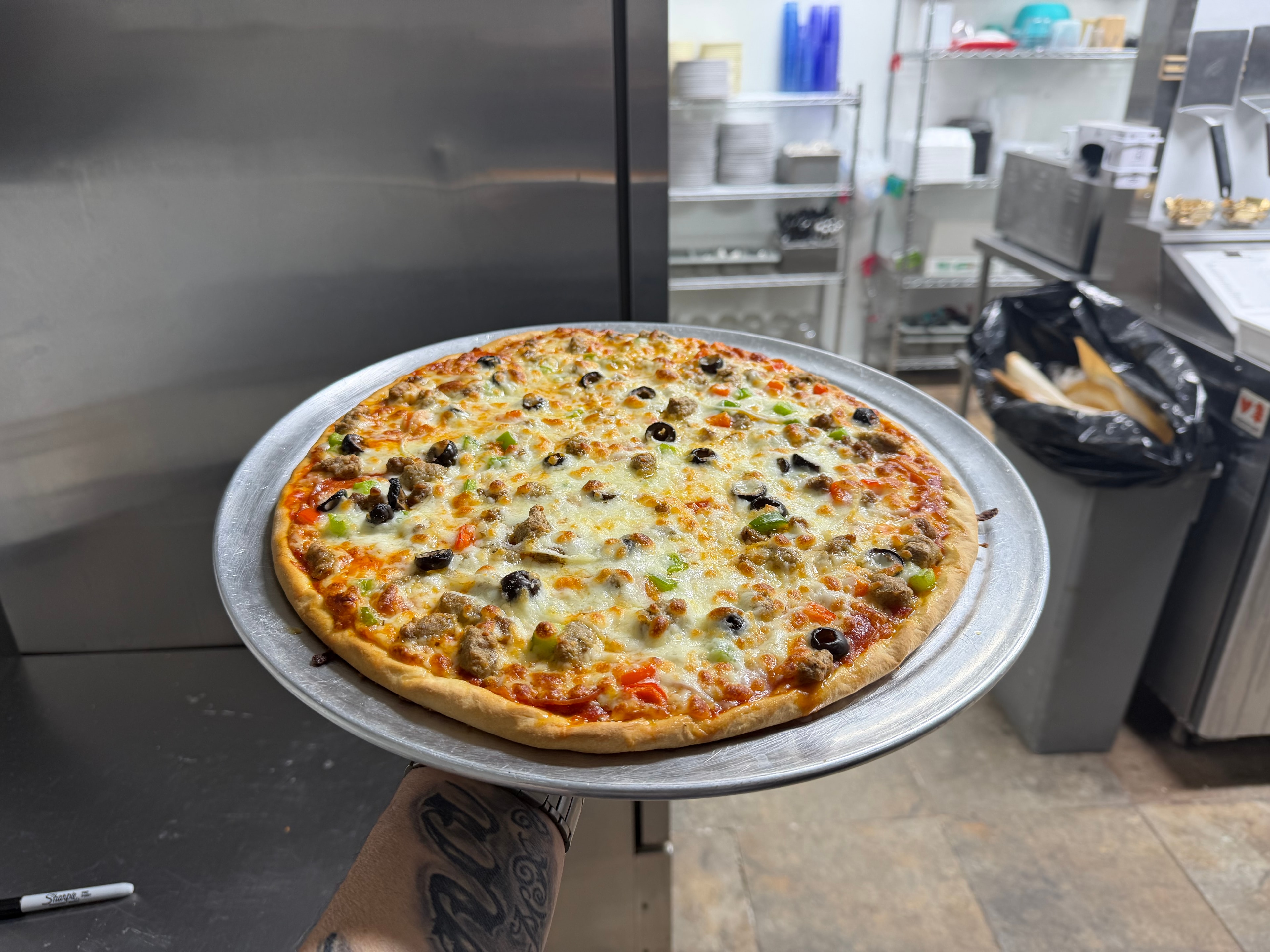 Loaded pizza at Nina's Pizza Shop